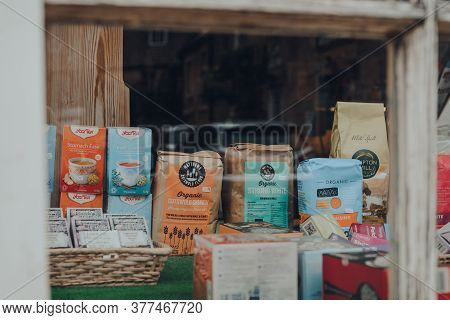 Stow-on-the-wold, Uk - July 6, 2020: View Through Window Of Products On Window Display Of Organic Sh