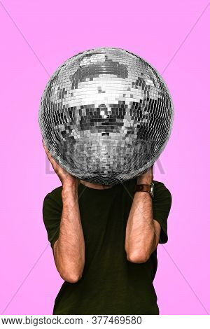 Man Holds A Disco Ball. Mirror Ball. Concept Of A Night Club Party, Club Life. Nightlife.