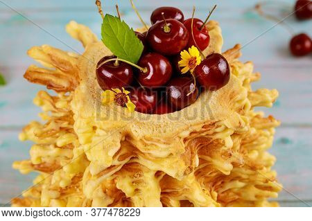Lithuanian Sakotis Cake With Sweet Cherries. Close Up.