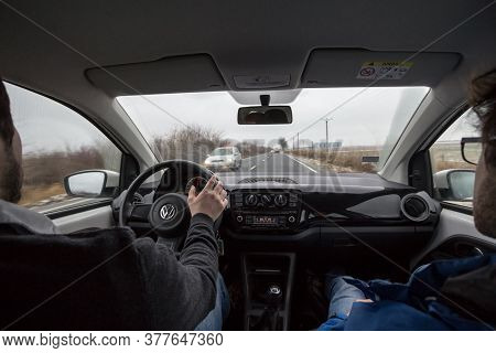 Timisoara, Romania - January 14, 2017: Man Driving A Volkswagen Car With Its Logo, Hands On The Stee