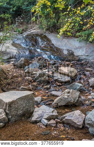 A Narrow Stream Of Water In Colorado Springs, Colorado
