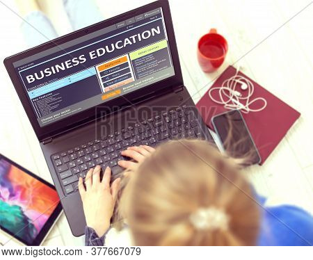 Business Education. Young Woman Writes A Text On Modern Portable Ultrabook Keyboard With Open Educat