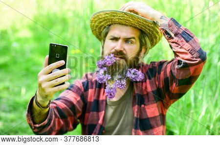 Cowboy Hipster In Field With Smartphone. Social Networks. Video Call. Internet Available In Most Rem