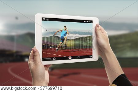 Close Up Hands Holding Tablet Viewing Sport, Maraphone Online Streaming Of Championship. New Rules D