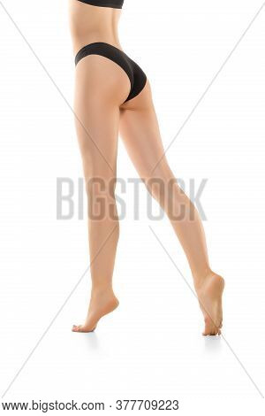 Light. Beautiful Female Legs, Buttlocks Isolated On White Background. Beauty, Cosmetics, Spa, Depila