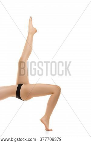 Light. Beautiful Female Legs, Buttlocks Isolated On White Background. Beauty, Cosmetics, Spa, Depila