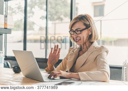Asian Business Woman Re Communicating Through Video Conferencing For Online Learning On Laptop