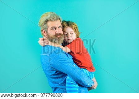 Dad And Son. Family Relationships. Family Time. Parentship Concept. Dad Hugs With Son. Bearded Man W