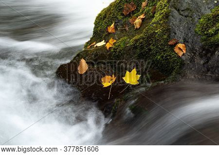 Landscape scenery of water falling near hilly region