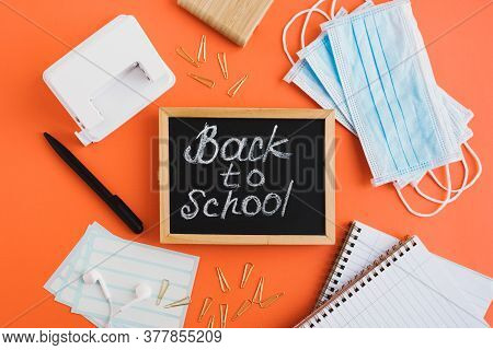Back To School During Covid 19 Pandemic Concept. Flat Lay With Blackboard With Text 