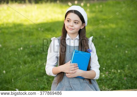 Be Mindful. Thoughtful Child Think Sitting On Bench Outdoors. Little Girl Back To School. Learning A