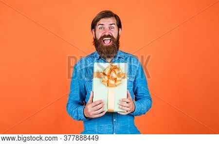 Happy Bearded Man With Present Box. Cheerful Brutal Hipster Hold Gift. Boxing Day. Birthday Surprise