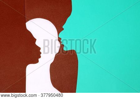 The Paper Profiles And Face Were Cut Out From Mint, Terracotta And White Paper
