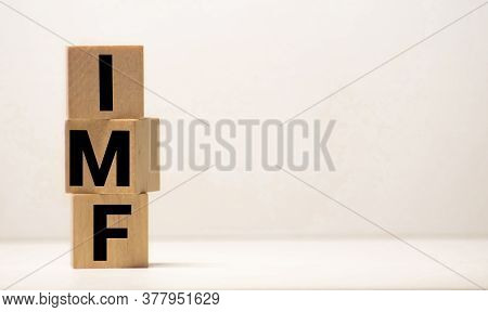 Imf Spelled With Wood Tiles Isolated On A White Background.