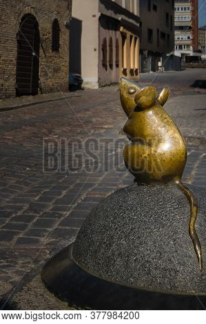 April 17, 2019, Klaipeda, Lithuania - City Attraction Of Tiny Mouse Street Statue In Old Town. City 