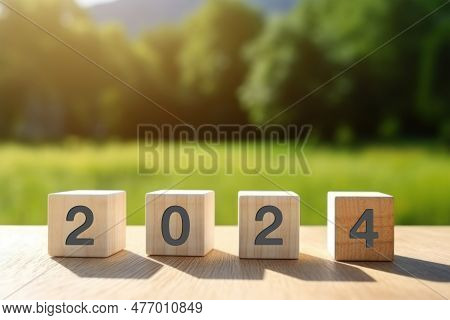 The Year 2024 Text On Wooden Cube. A New Era Of Creative Inspiration And Concept Background. Make A