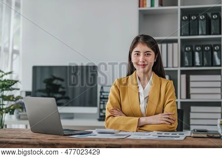 Portrait Of Smiling Beautiful Business Asian Woman Working In Office Use Computer With Copy Space. B