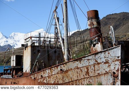 Abandoned Ship (whaling Vessel) At Grytviken, South Georgia Island With Snowy Mountain View