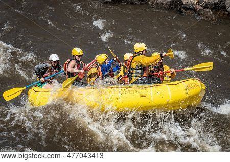 Group Of People Rafting The Arkansas River In Colorado