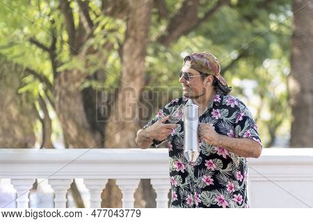 Hispanic Artist Playing Güiro In The Street