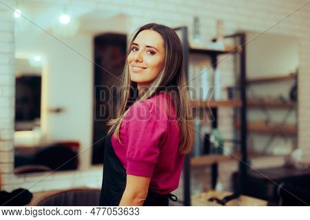 Hairdresser Wearing Uniform Standing In Hair Salon