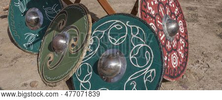 Celtiberian Shield Resting On The Ground, Caetra Replicas. Historical Reenactment
