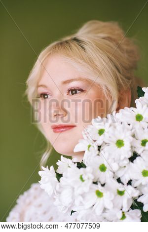 Beauty Portrait Of Pretty Young 15 - 16 Year Old Teeenage Girl Wearing White Dress Posing On Green B