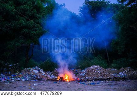 Unscientific Burning Of Garbage In A Public Place In A Late Evening