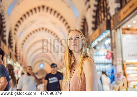 A Tourist Woman Walks Among The Countless Shops At The Grand Bazaar And Egyptian Bazaar In Istanbul.