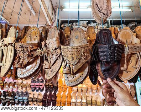 Stock Photo Of Popular And Traditional Kolhapuri Chappal Hanging In The Display For Sale In The Loca