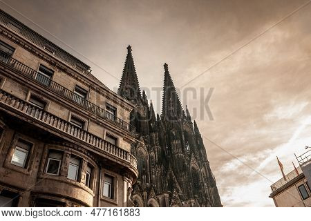 Cologne Cathedral With A Residential Apartment Building In Front With Blue Sky. Cologne Cathedral, O