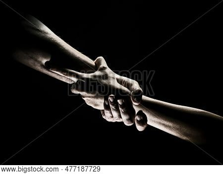 Two Trength Ands. Helping Hand To A Friend. Rescue Or Helping Gesture Of Hands. Concept Of Salvation