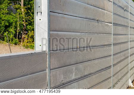 Unfinished Grey Noise Barrier On The Street. Selective Focus