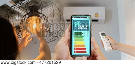 Woman Change A New Electric Bulb, Open Air Conditioning 26 Degrees Make A Home More Energy Efficient