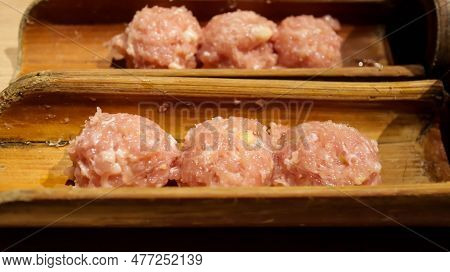 Tsukune Is A Type Of Japanese Meatball Most Often Made From Seasoned Chicken Mince. Served In A Bamb