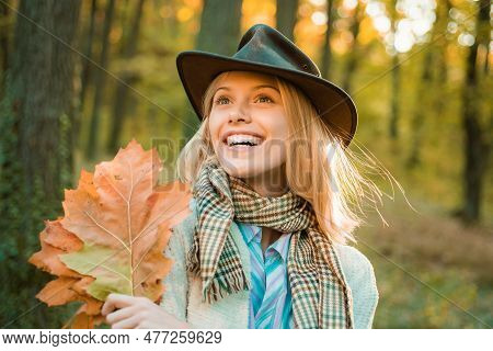 Autumn Girl Wearing In Autumn Clothes And Looks Very Sensually. Autumn Dream. Woman Dreams In Autumn