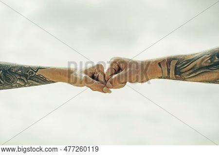 Couple Hands With Tattoo. Helping Hand. Holding Hand, Close Up. Giving A Help Hand. Rescue, Helping 