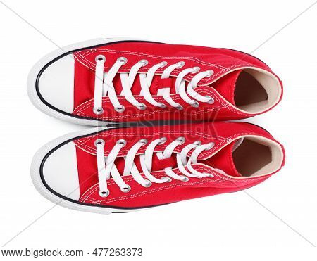 Pair Of New Red Stylish Plimsolls On White Background, Top View