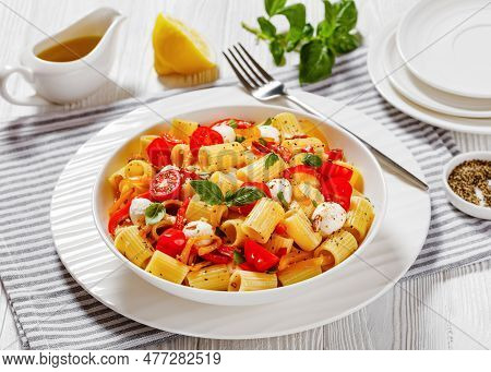 Roasted Pepper Tomato Mozzarella Pasta Salad In White Bowl On White Wood Table, Horizontal View From