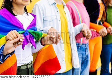 Young Group Of Lgbt Community People Holding Hands Outdoors Showing Support, Equality, Inclusion And