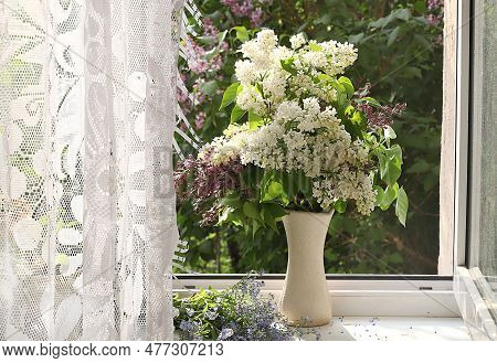 Home Interior With Decor Elements, Beautiful Spring Lilac Branches In A Vase On A Sunny Window, Abst
