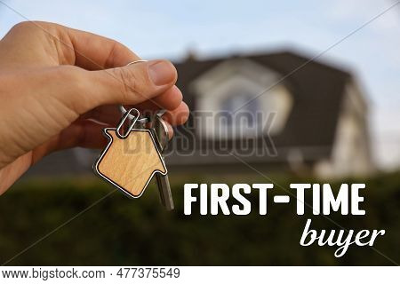 First-time Buyer. Woman Holding House Keys Outdoors, Closeup