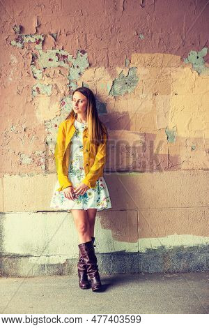 Woman Casual Fashion. A Pretty  Girl Wearing Flower Patterned Underdress, Yellow Corduroy Jacket, Br