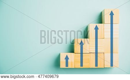 Business Growth Success Depicted Through A Ladder Career Path Concept. Wooden Blocks Stacked As Step