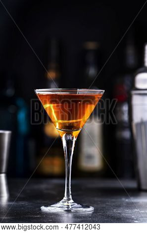 Bobby Burns Alcoholic Cocktail Drink With Scotch Whiskey, Vermouth And Liquor In Martini Glass, Dark