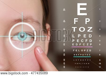Vision Test Chart And Laser Reticle Focused On Woman's Eye Against Blurred Background, Closeup