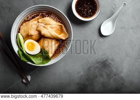 Homemade Chinese Wonton Soup With Bok Choy On Concrete Background, Copy Space. Miso Soup With Shrimp