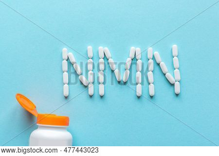 Niacin, Nicotinamide Mononucleotide,  Anti Adeing Vitamin. White Pills Forming Shape To Nmn Alphabet