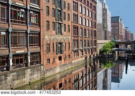 Hamburg, Germany - July 25, 2012: Reflection Of Brick Houses And Bridge At Alsterfleet In Hamburg, P