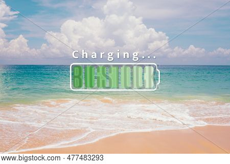 Fully Charge Battery 100% Sign Icon On Natare Summer Beach On Vacation Day. Holiday Long Weekend Rel